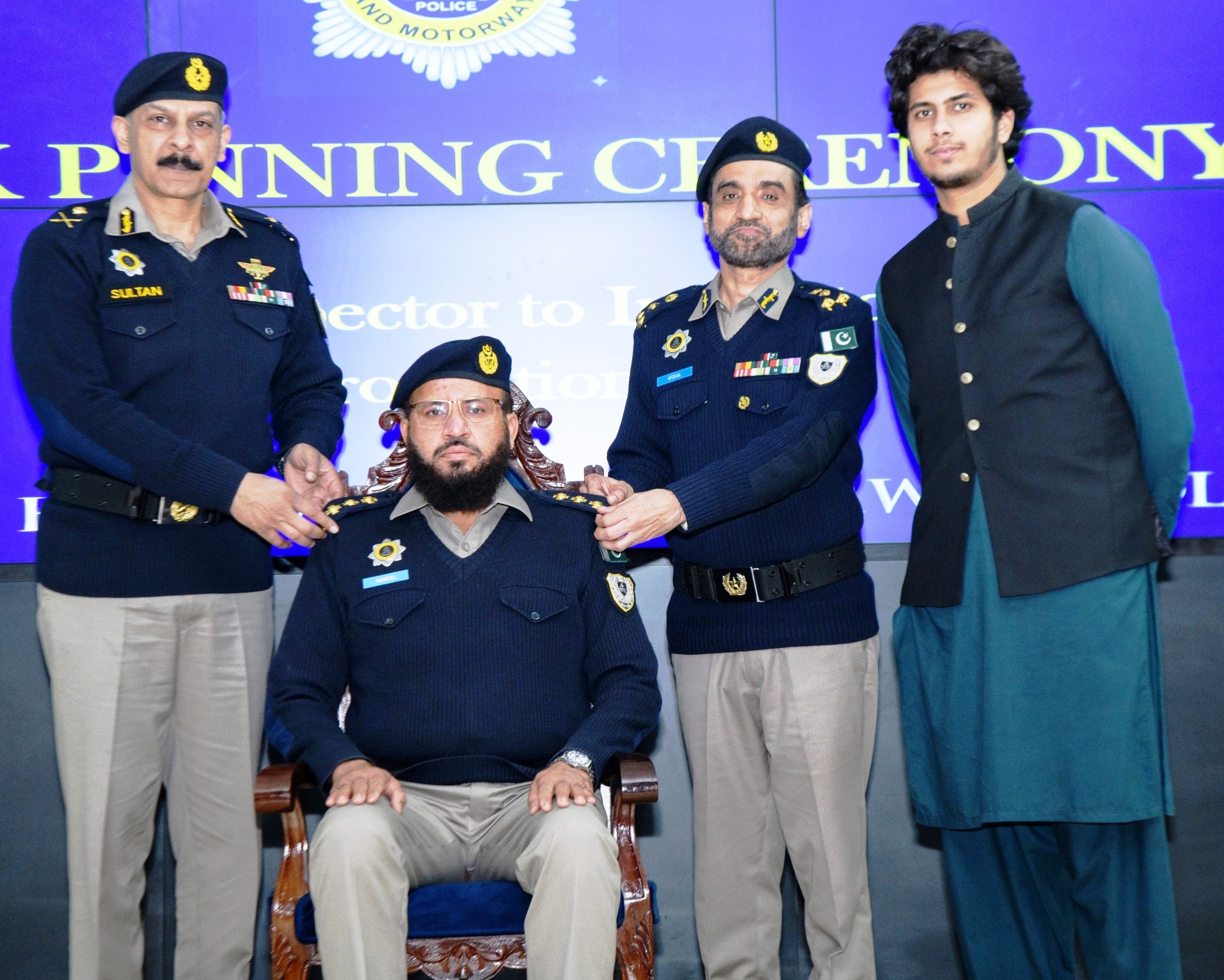 THE INSPECTOR GENERAL, NHMP, PINNED THE RANKS ON THE NEWLY PROMOTED INSPECTORS.